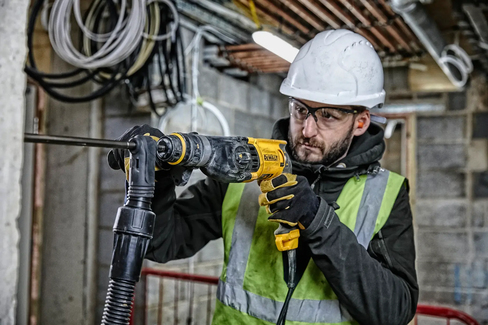 Photo of worker using DEWALT drill, SKUs D25134K-B3, D25134K, D25134K-B2C, D25134K-B2 in construction setting.